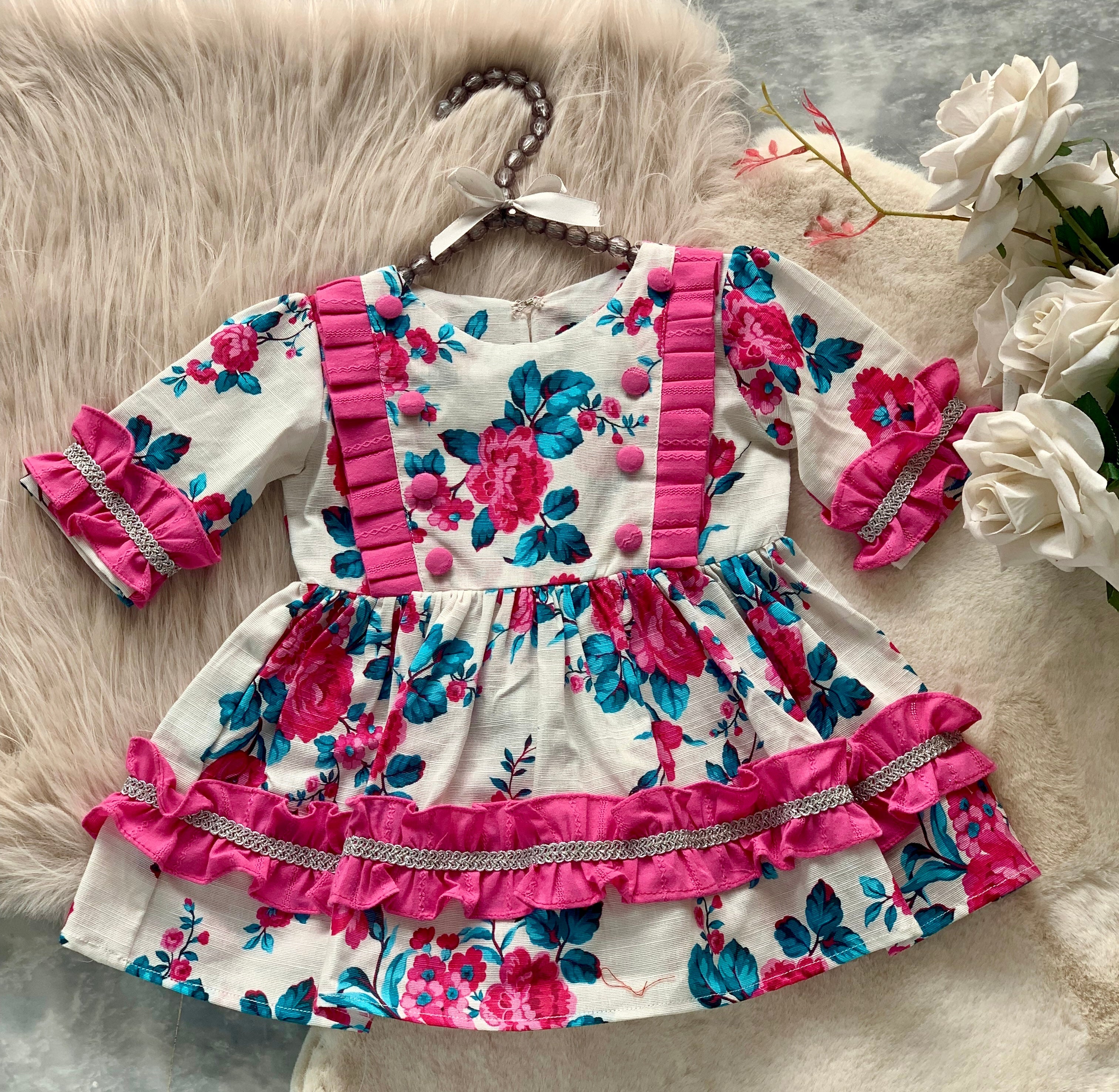 0703-Khaddar Pink Floral Patterns Sleeves less Frock